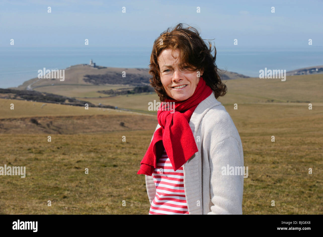 Actress Janet Dibley on the South Downs near Eastbourne and Belle Toute lighthouse East Sussex, UK. Picture by Jim Holden. Stock Photo