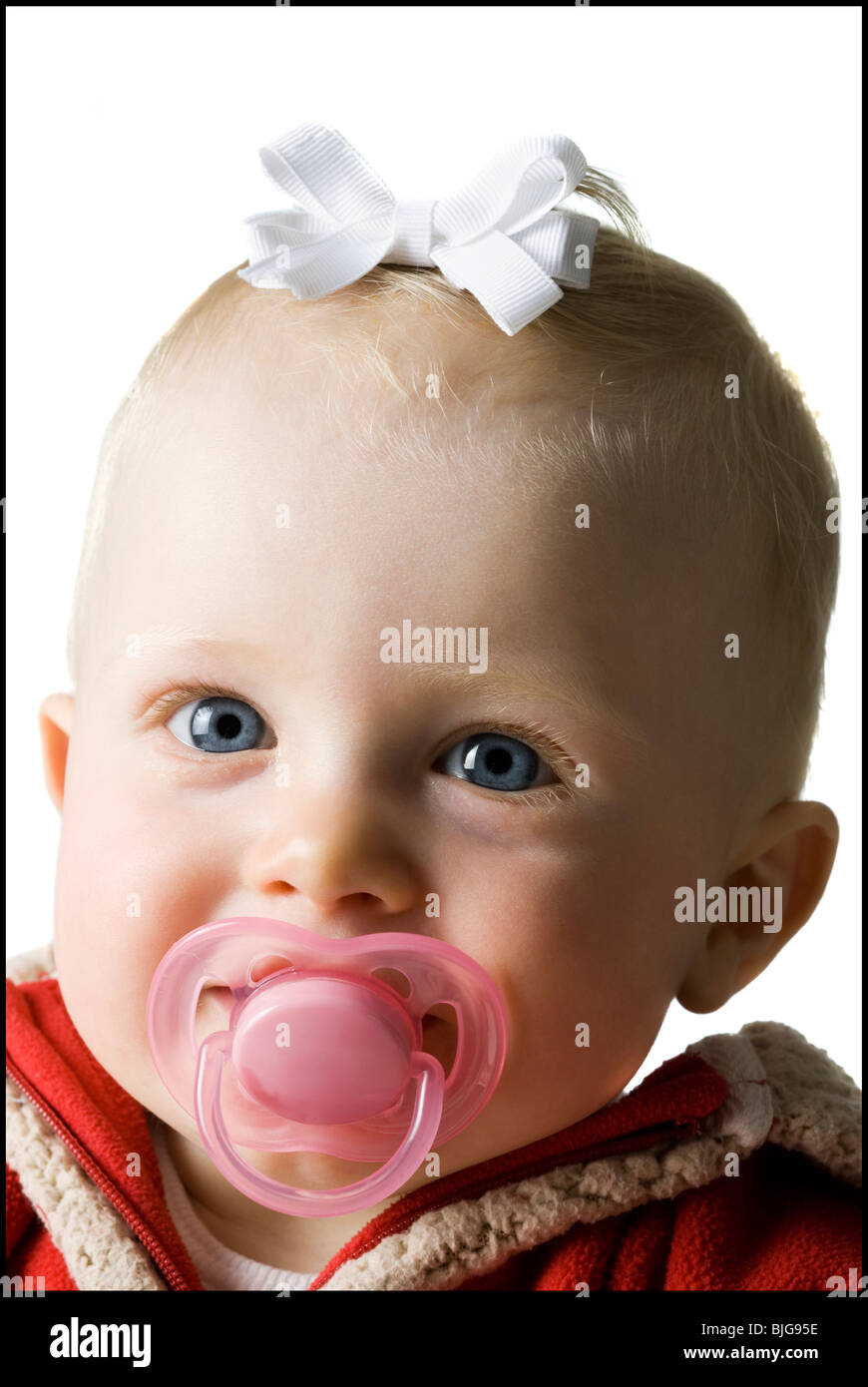 baby girl in a red coat Stock Photo Alamy