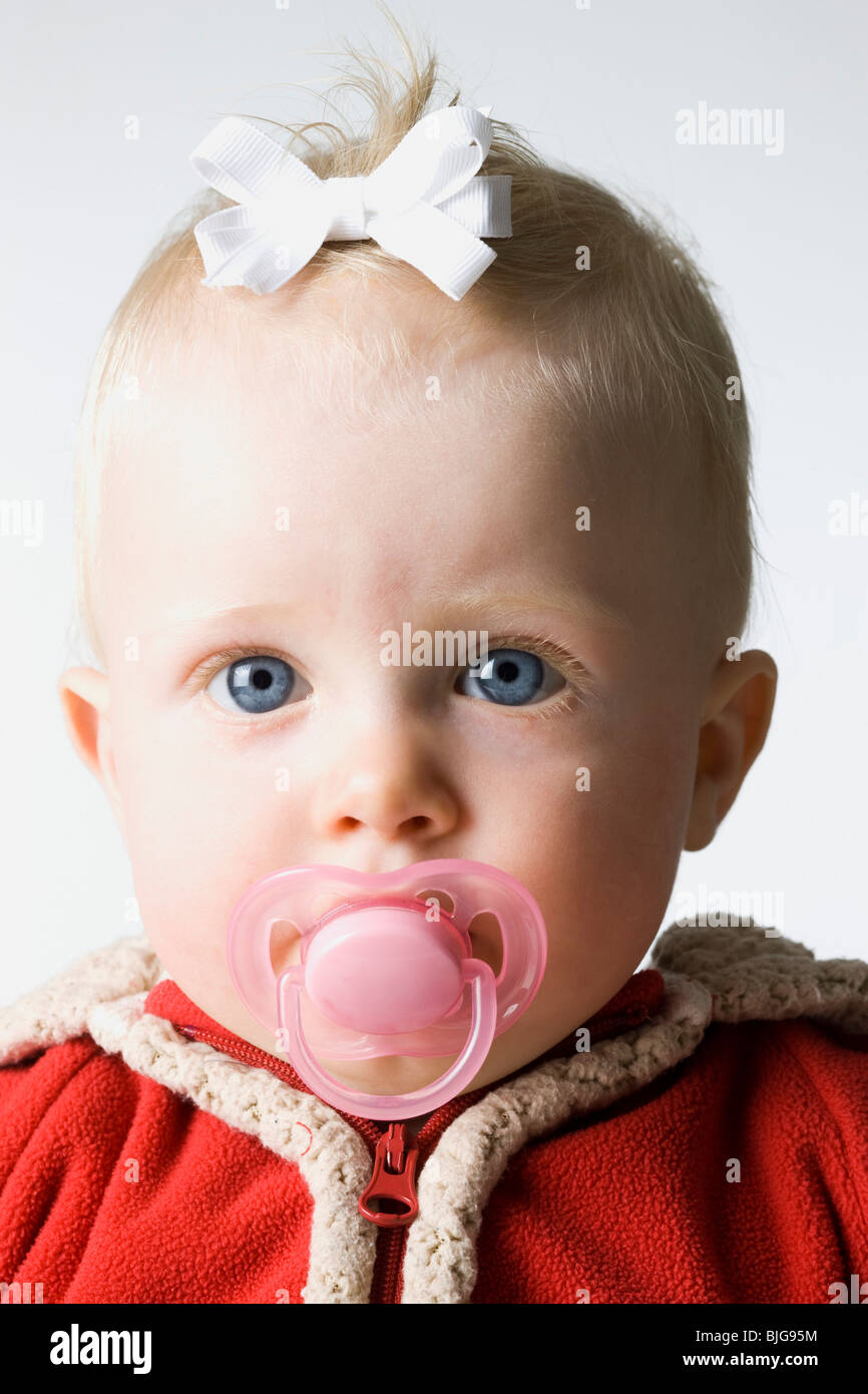 baby girl in a red coat Stock Photo Alamy