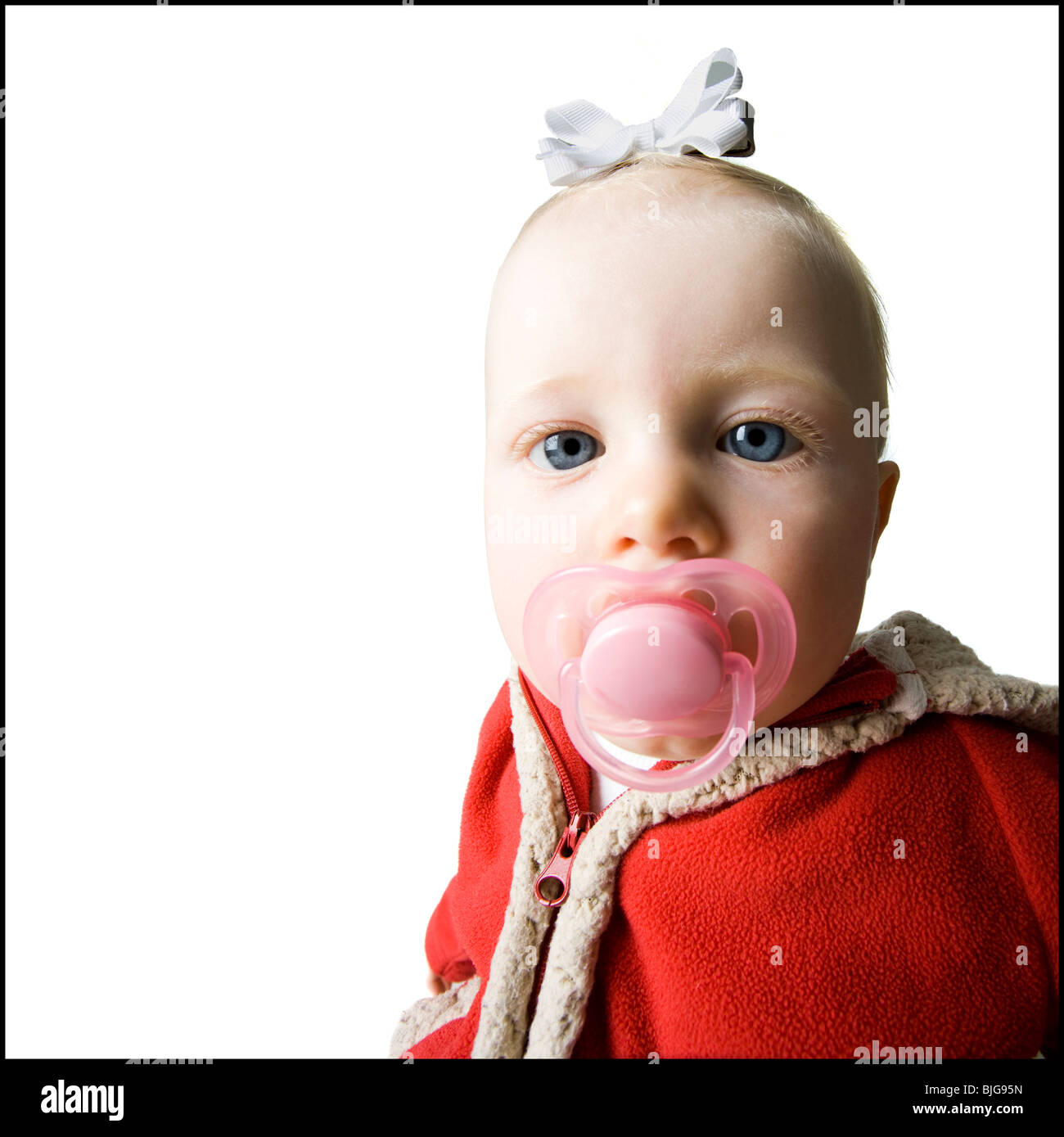 baby girl in a red coat Stock Photo Alamy