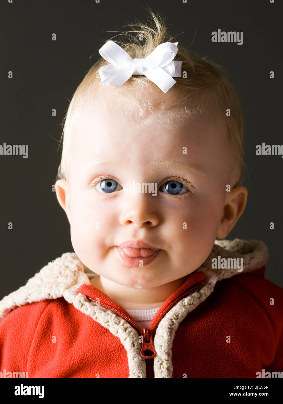 baby girl in a red coat Stock Photo Alamy