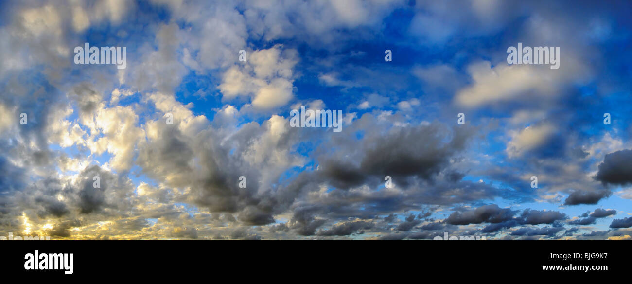 A view of panoramic sunset sky with colorful clouds Stock Photo - Alamy