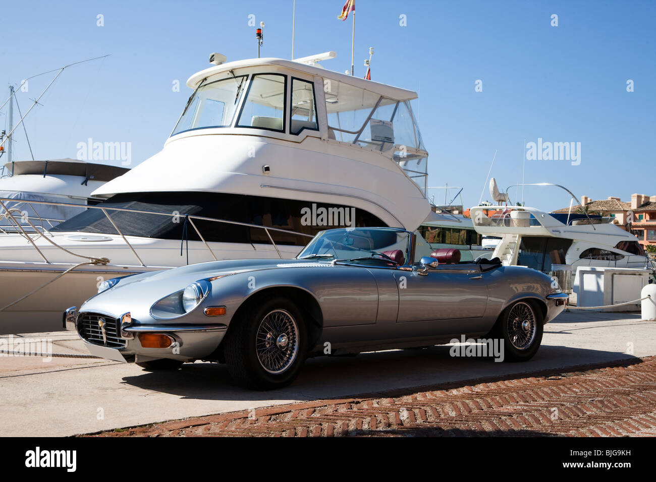 E type Jaguar parked on marina, Sotogrande, Spain Stock Photo