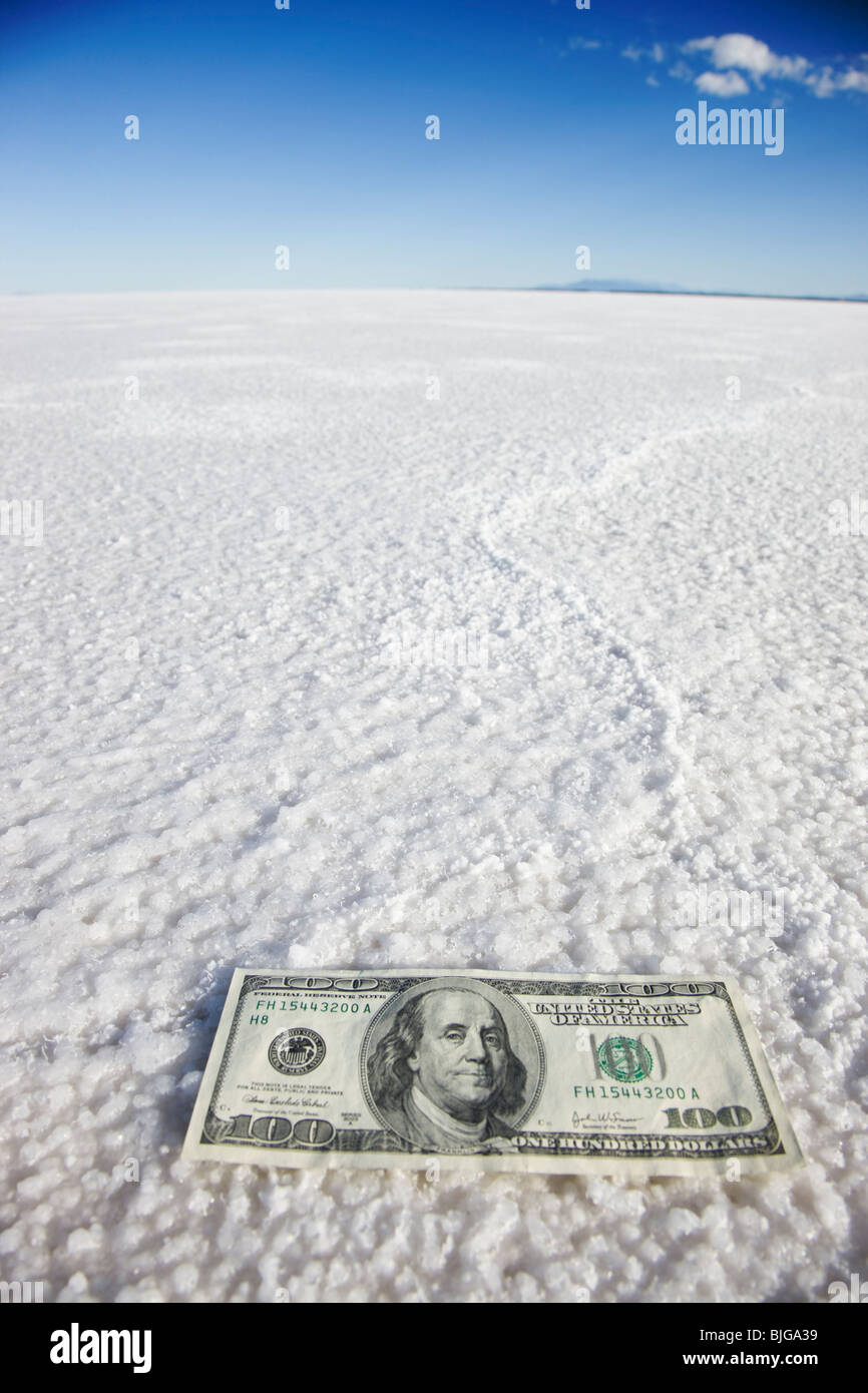 one hundred dollar bill in the middle of nowhere Stock Photo