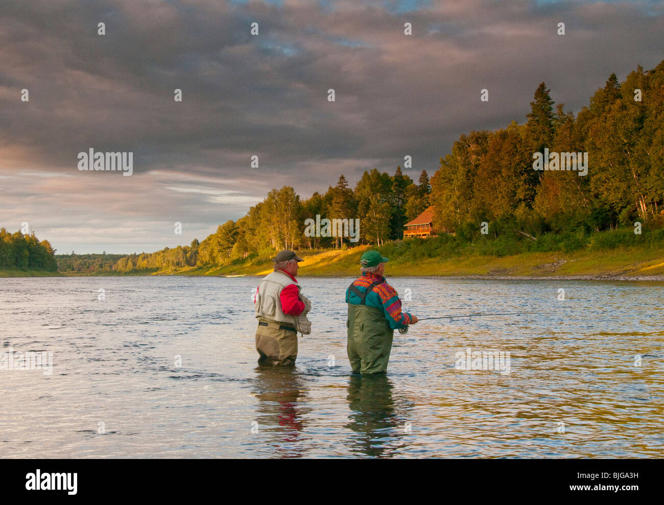 NEW BRUNSWICK, Fly fisherman casting for Atlantic Salmon on the Famous