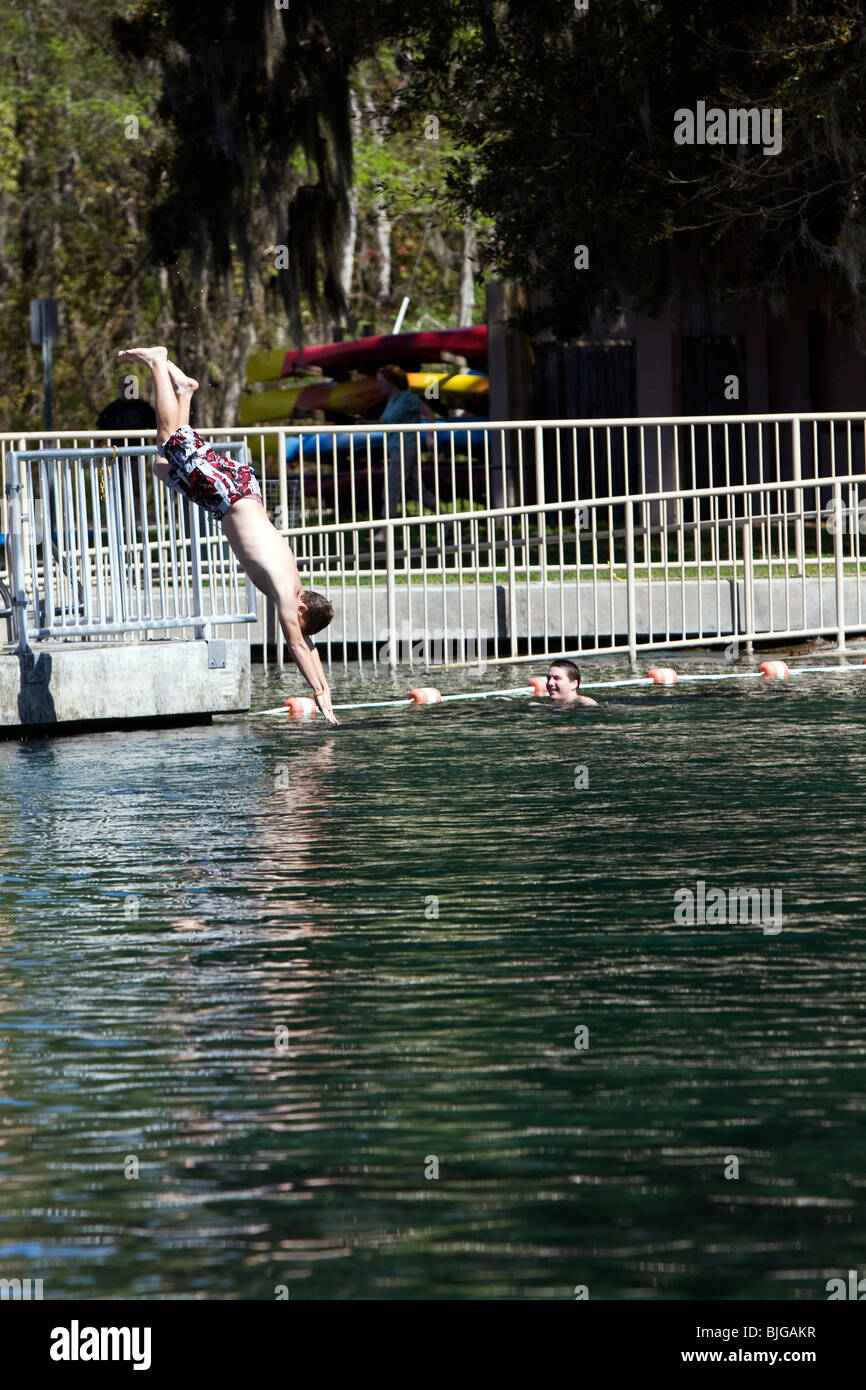 Teens diving in to De Leon Springs into cold water Stock Photo Alamy