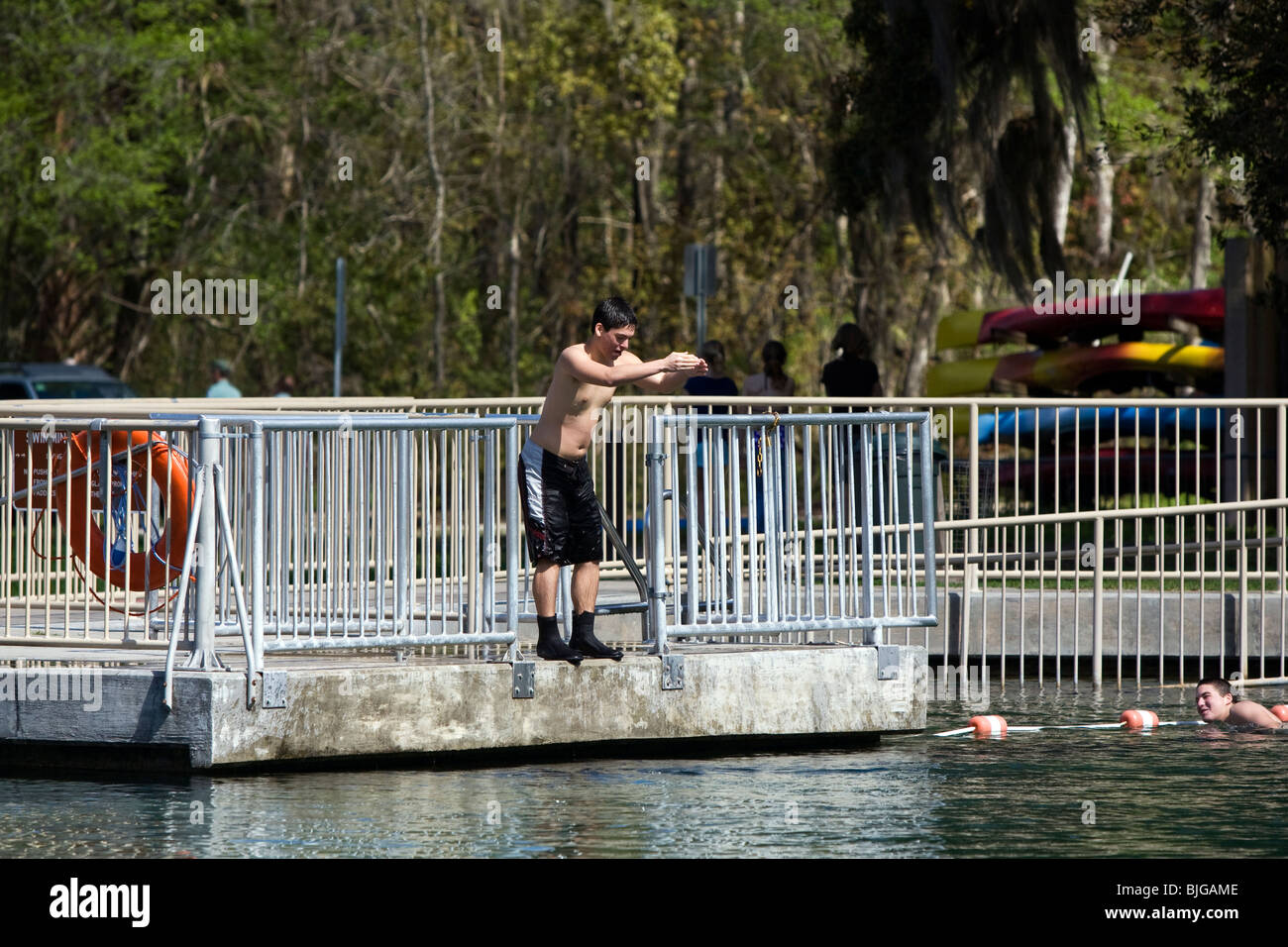 Teens diving in to De Leon Springs into cold water Stock Photo Alamy