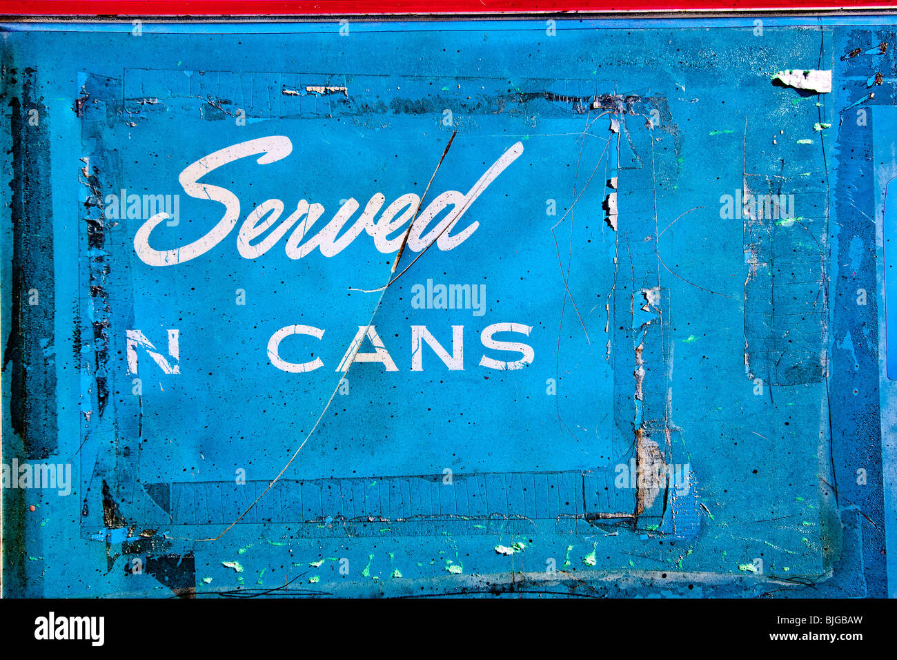 'Served in Cans' -- the front of a vintage soda machine in Guffey, Colorado, USA. Stock Photo