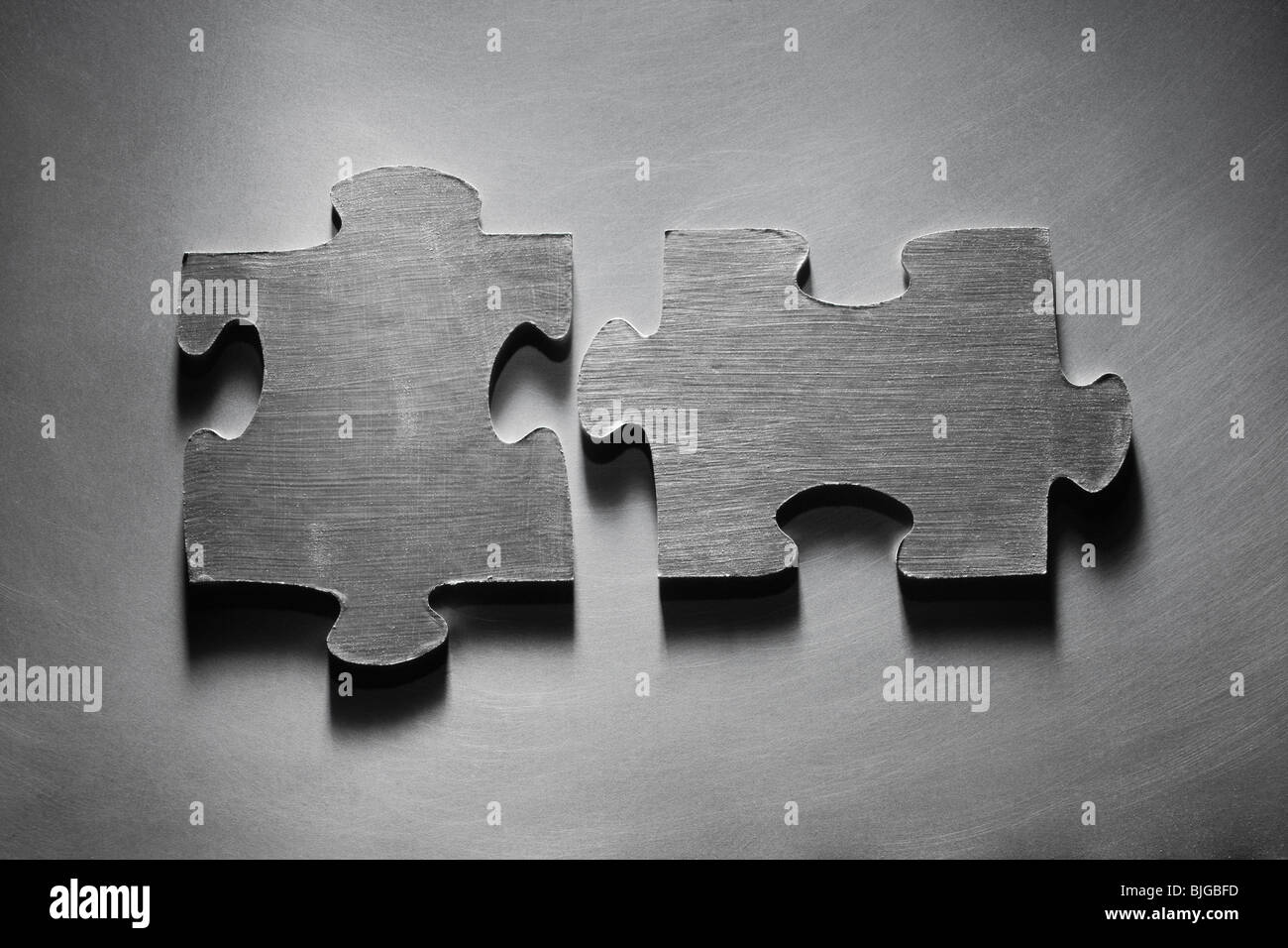 metallic puzzle pieces Stock Photo