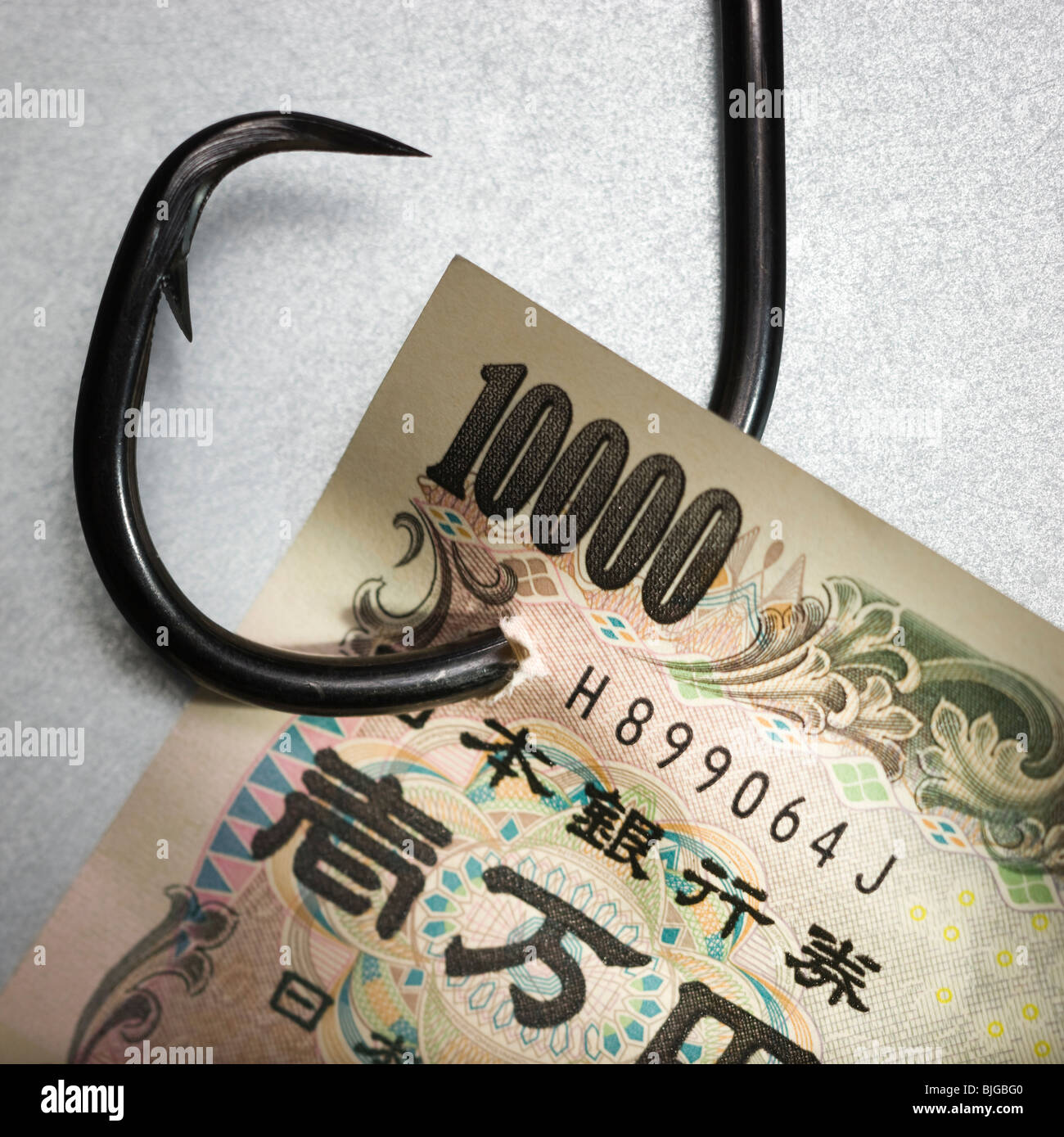 money on a fish hook Stock Photo
