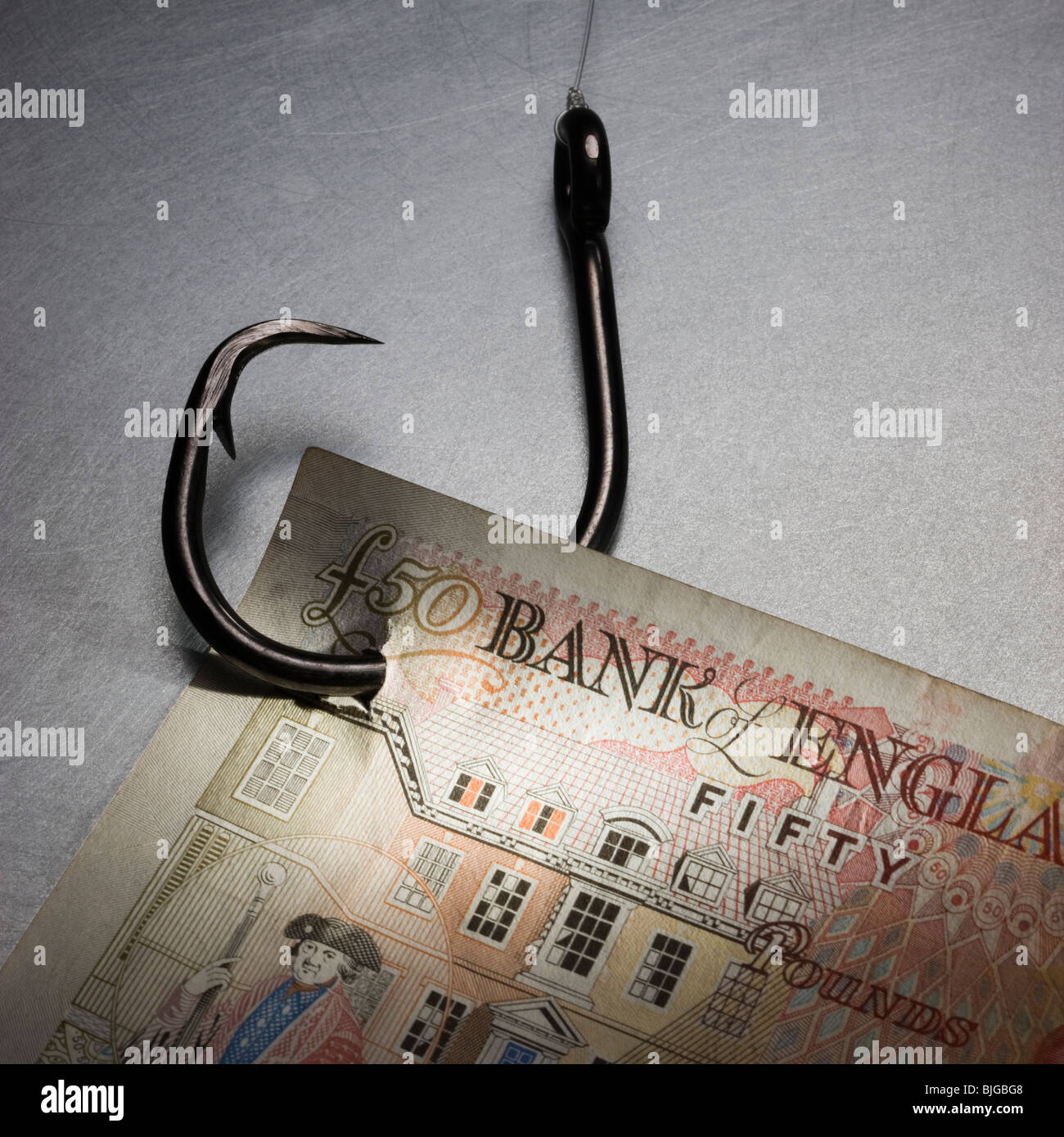 money on a fish hook Stock Photo
