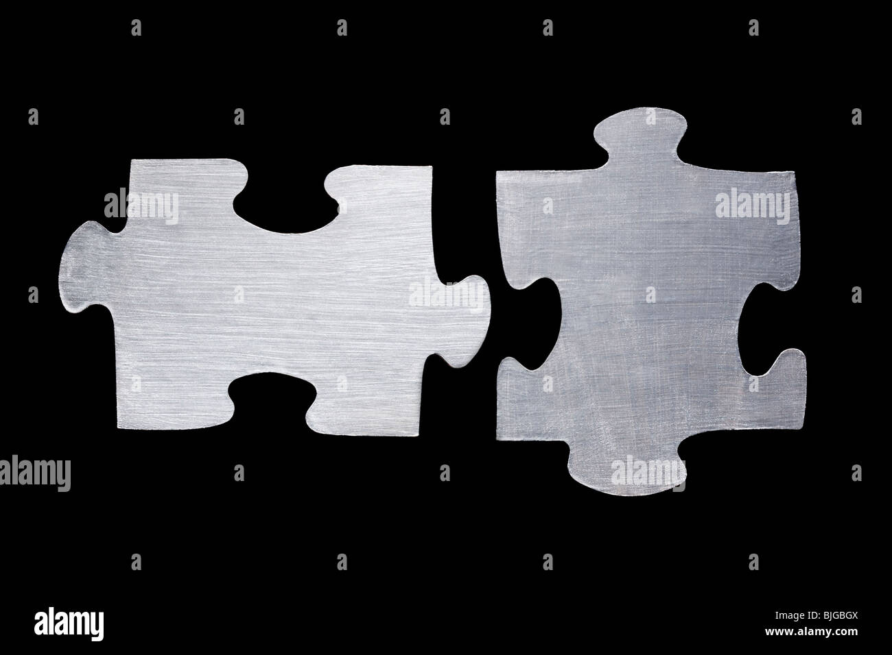 metallic puzzle pieces Stock Photo