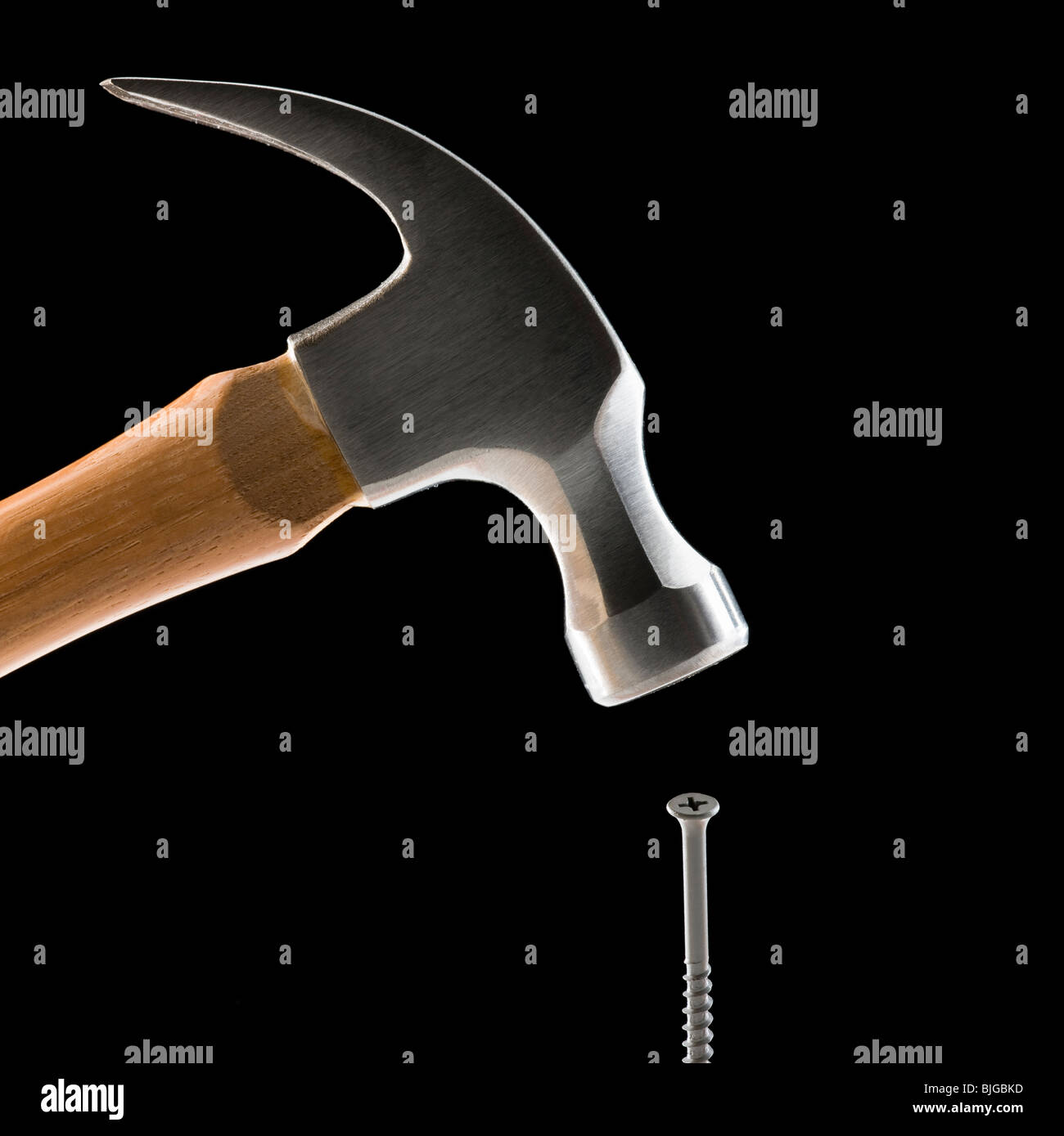 hammer hitting a screw Stock Photo Alamy