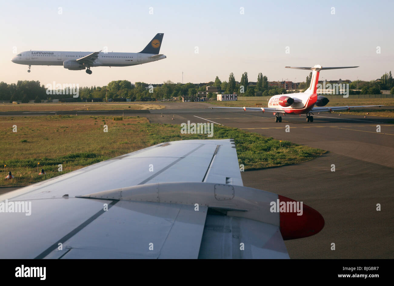 Aircrafts on the runway of the Tegel Airport, Berlin, Germany Stock Photo
