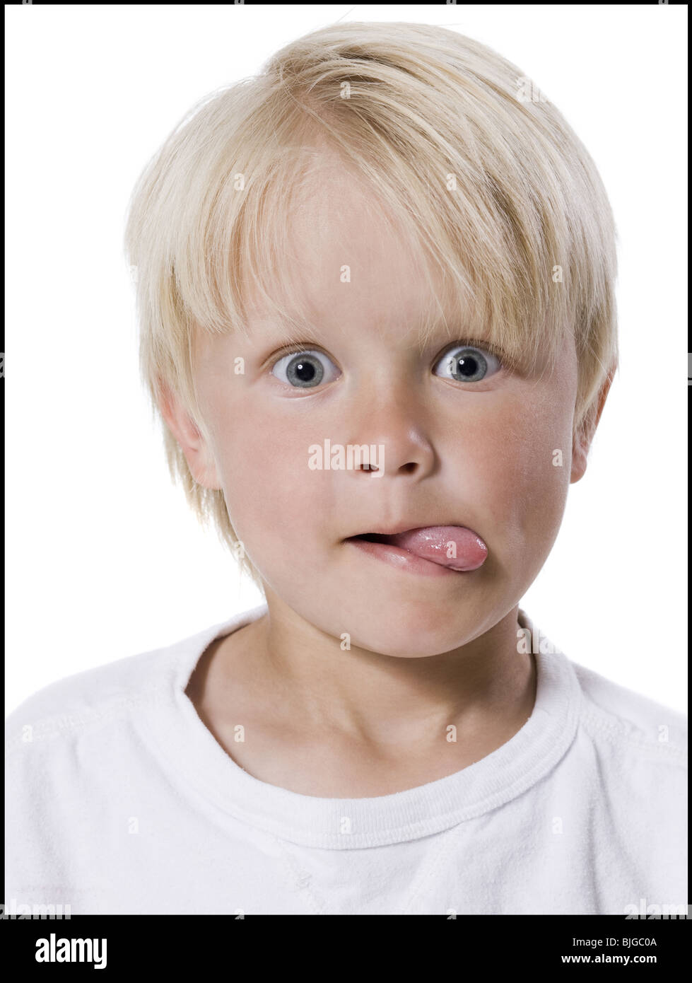 boy sticking out his tongue Stock Photo Alamy
