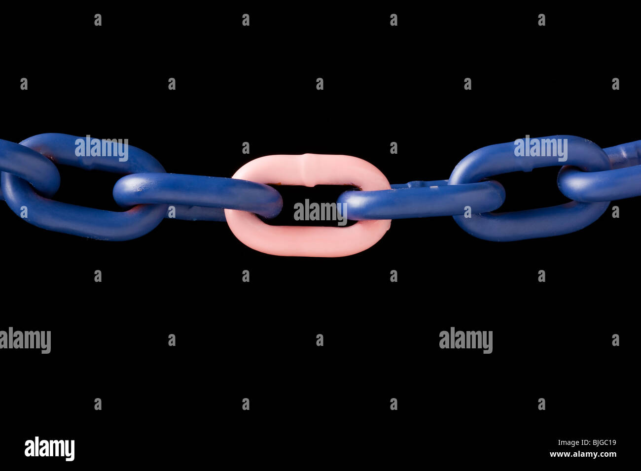 pink link in a blue chain Stock Photo