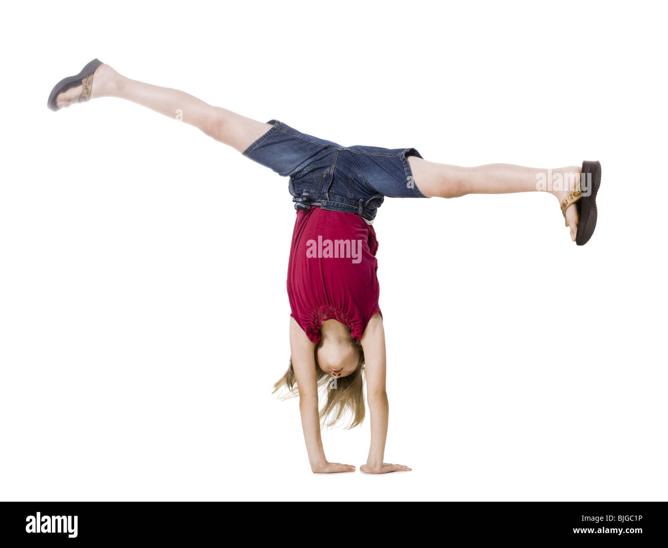 girl doing a hand stand Stock Photo