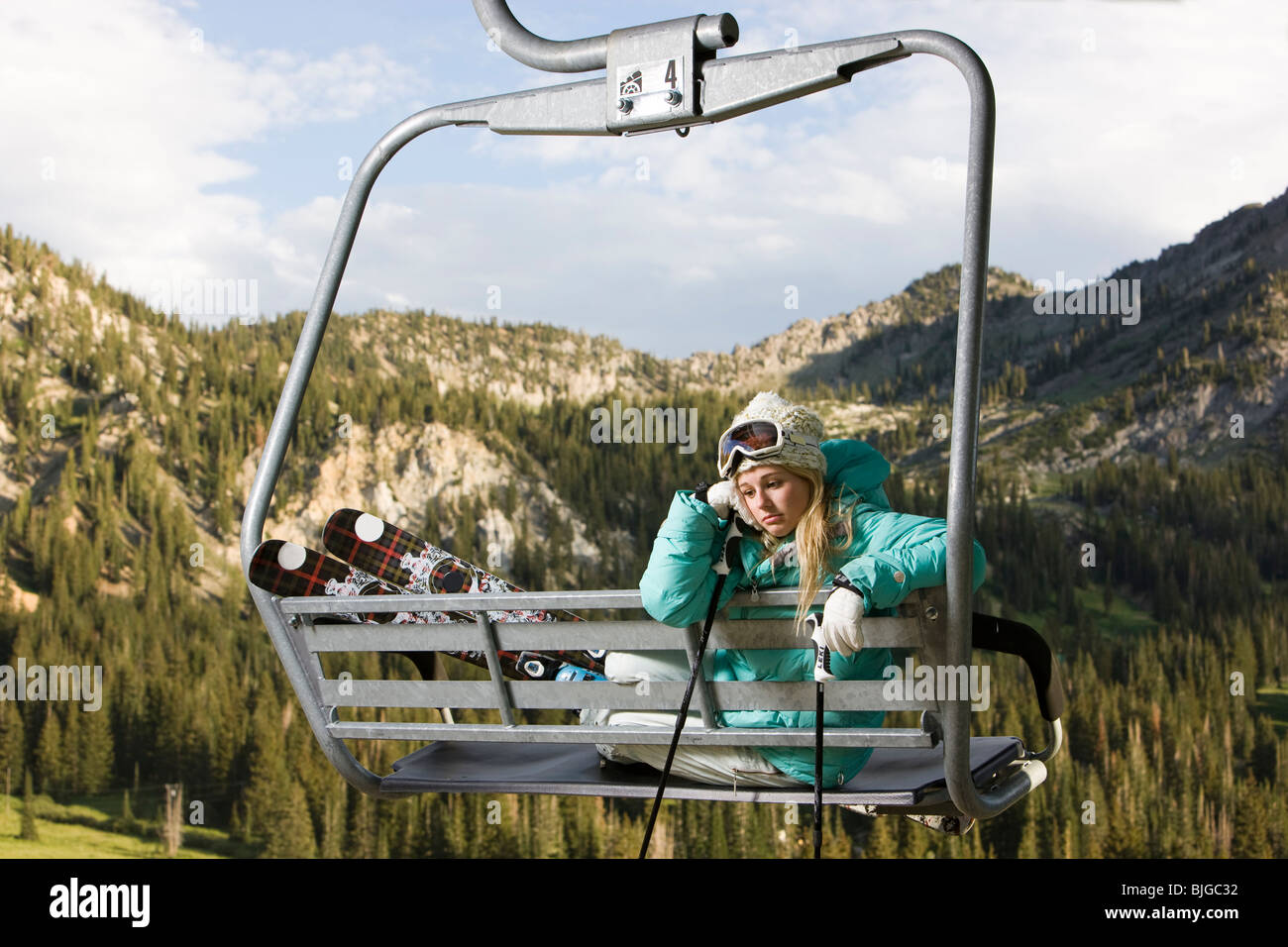 skier on a ski lift during the summer Stock Photo