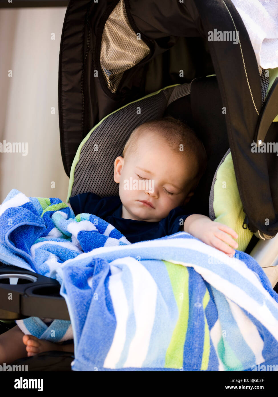 baby sleeping in stroller Stock Photo Alamy