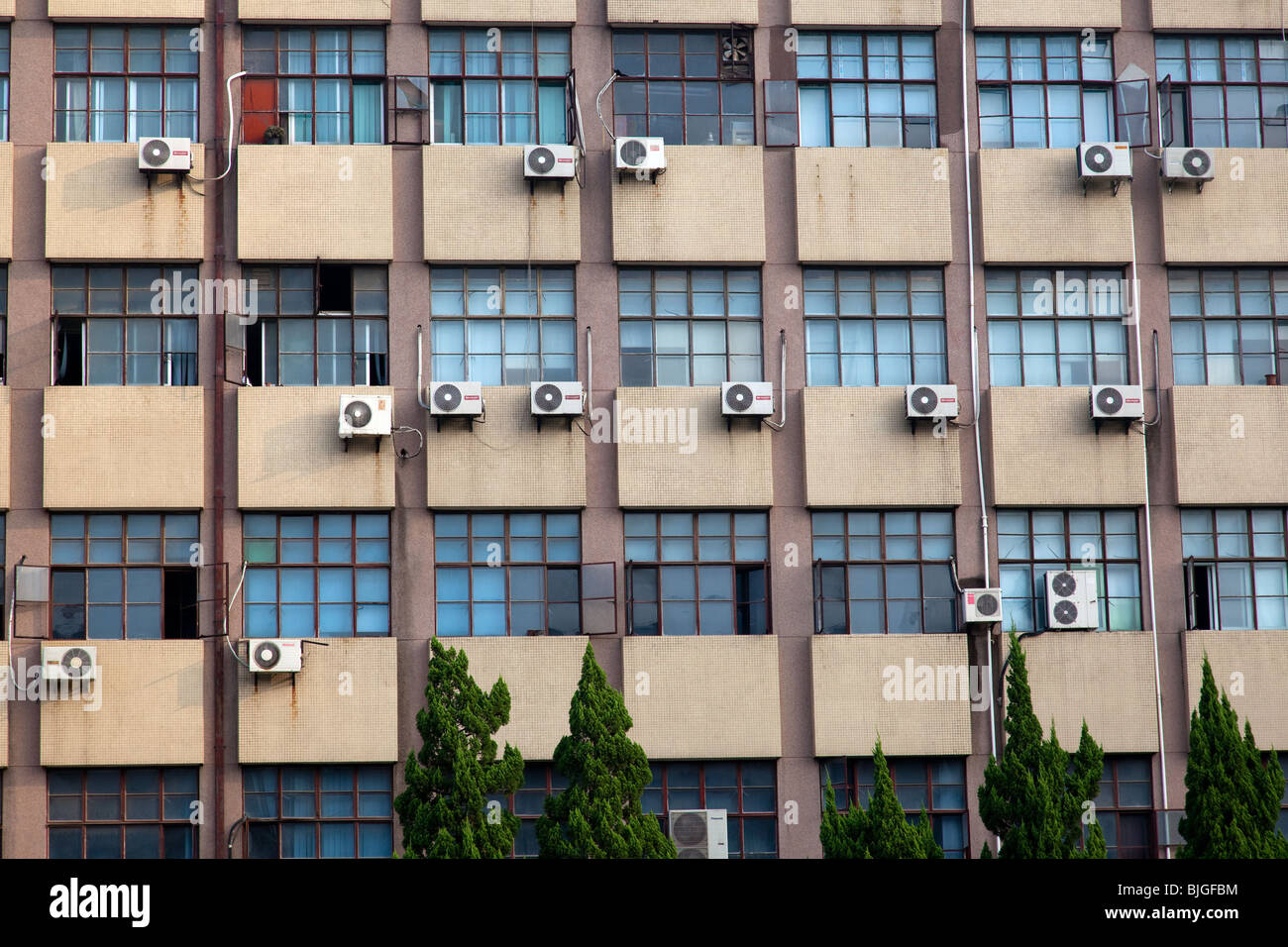 Building with many air conditioning units on campus of Fudan University, Shanghai, China Stock Photo