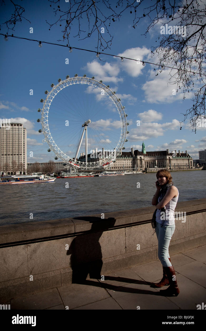 Woman opposite the London Eye Stock Photo Alamy