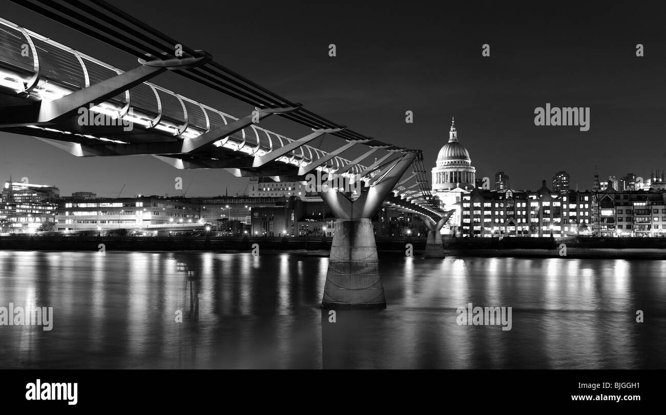 Horizontal image of View of St Paul's Cathedral and the Millennium Bridge and City at night  London England Stock Photo