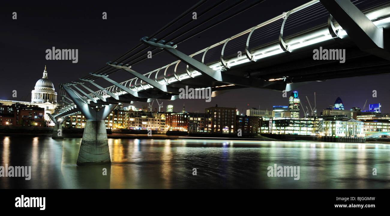 Horizontal image of View of St Paul's Cathedral and the Millennium Bridge and City at night  London England Stock Photo
