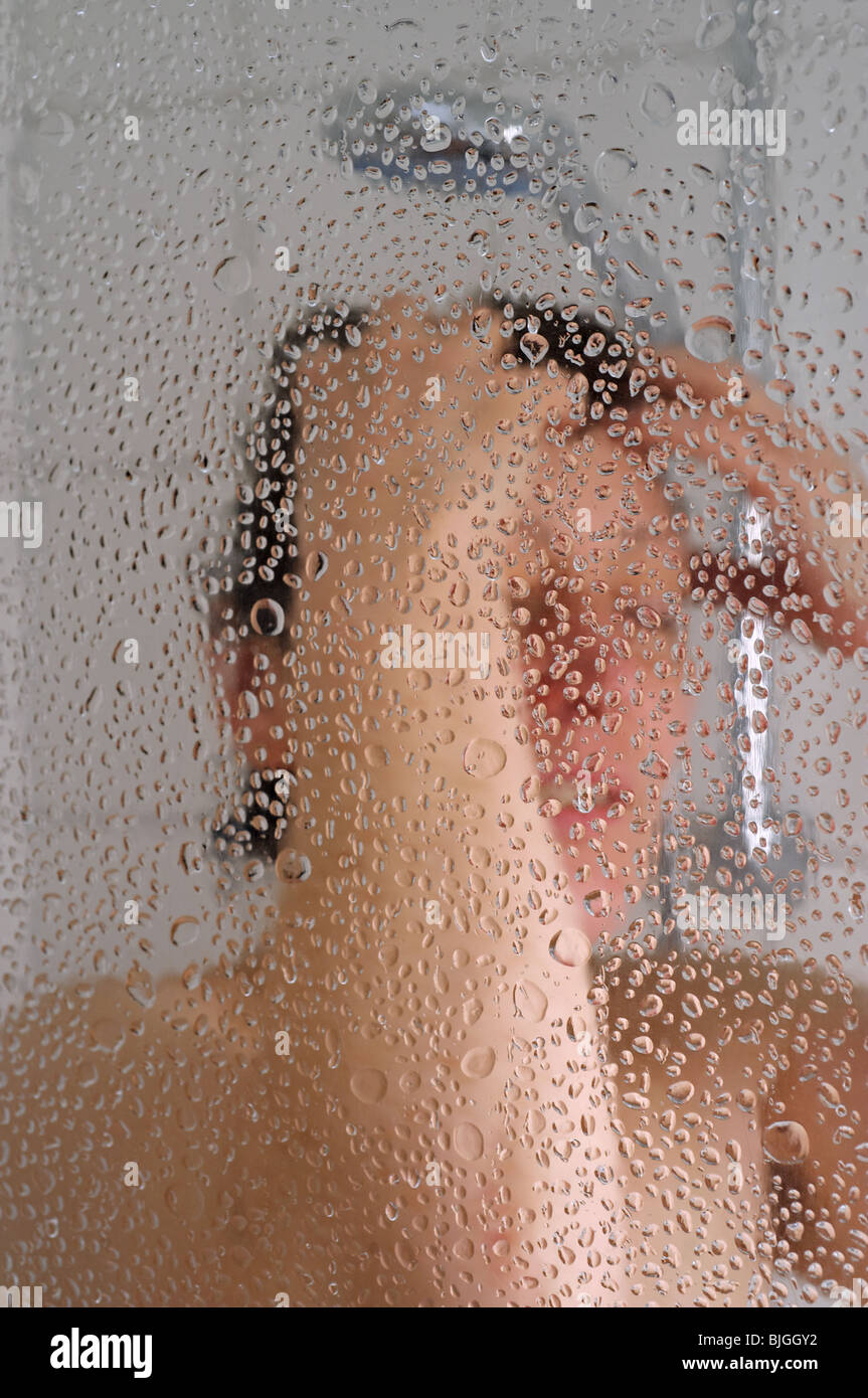 Woman taking hot shower Stock Photo Alamy