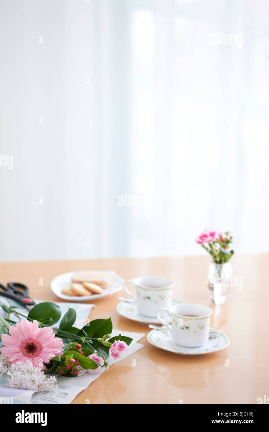 Afternoon Tea And Cookies On A Living Room Table Stock Photo