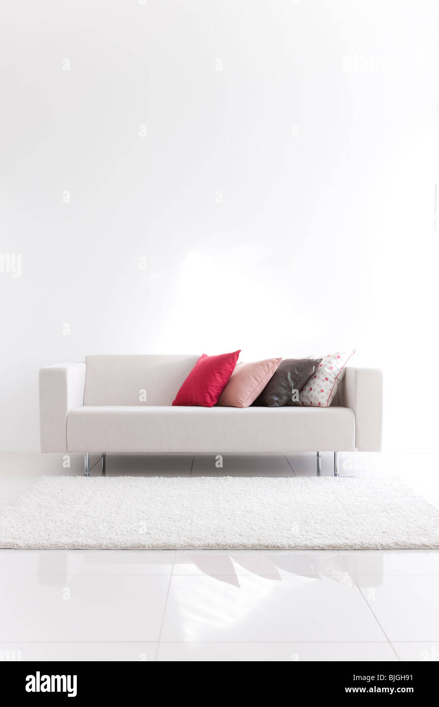 Sofa with cushions in a living room Stock Photo