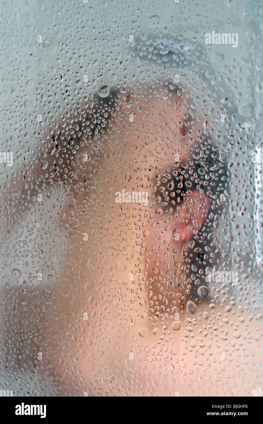 Woman taking hot shower Stock Photo Alamy