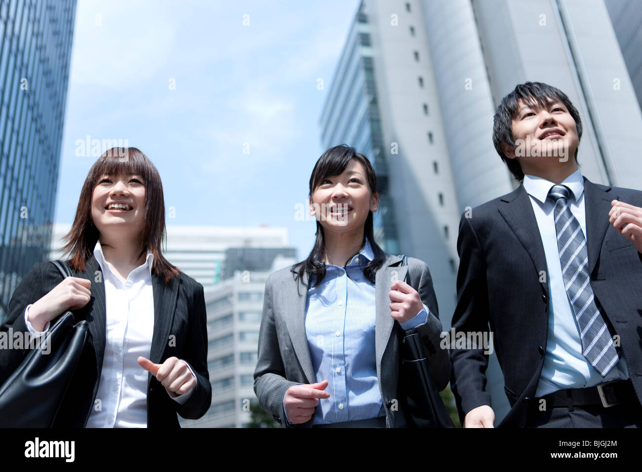 Businessman and businesswomen running in street Stock Photo - Alamy