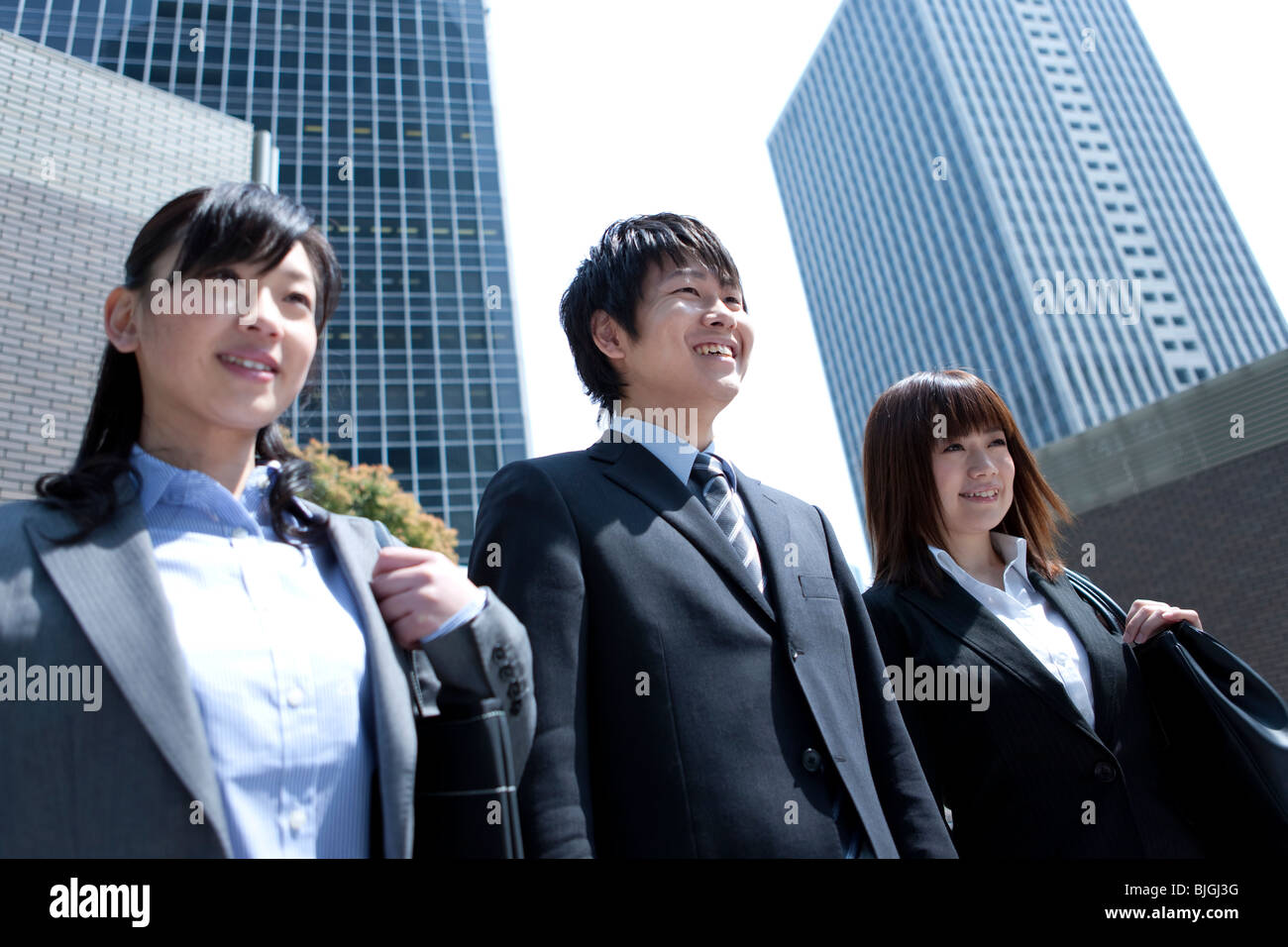 Businessman and businesswomen standing in street Stock Photo - Alamy