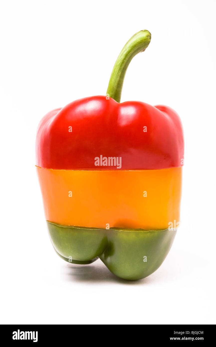 A selection of sliced sweet bell peppers arranged to resemble a set of Traffic Lights isolated against white. Stock Photo
