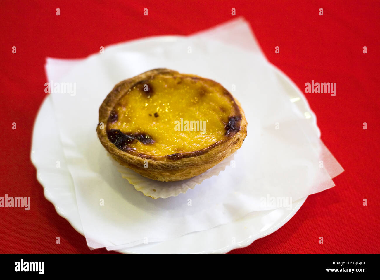 A Pastel de Nata cake is served in a cafe in Funchal on Madeira, Portugal. Stock Photo