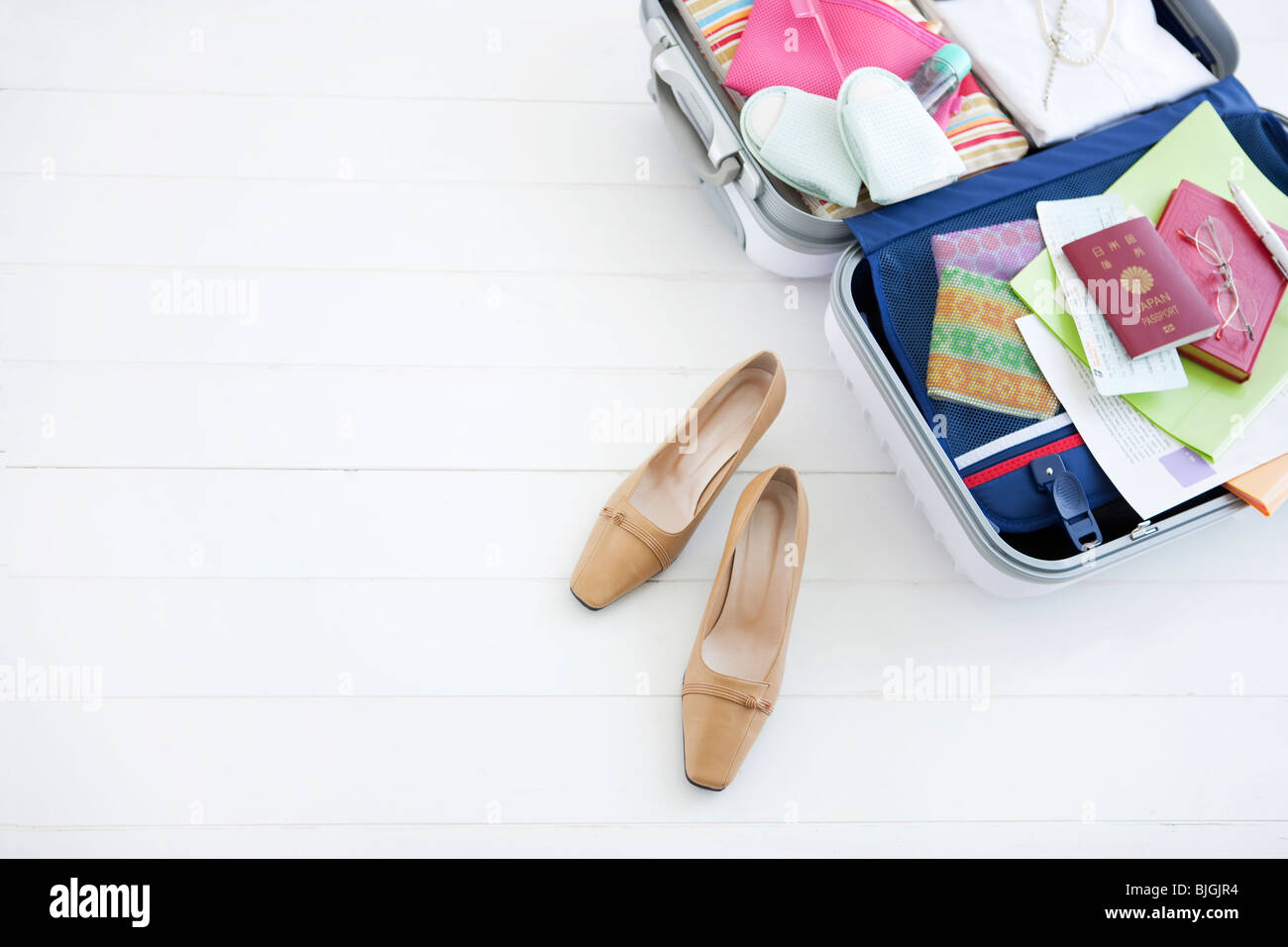 Packed suitcase lying open Stock Photo