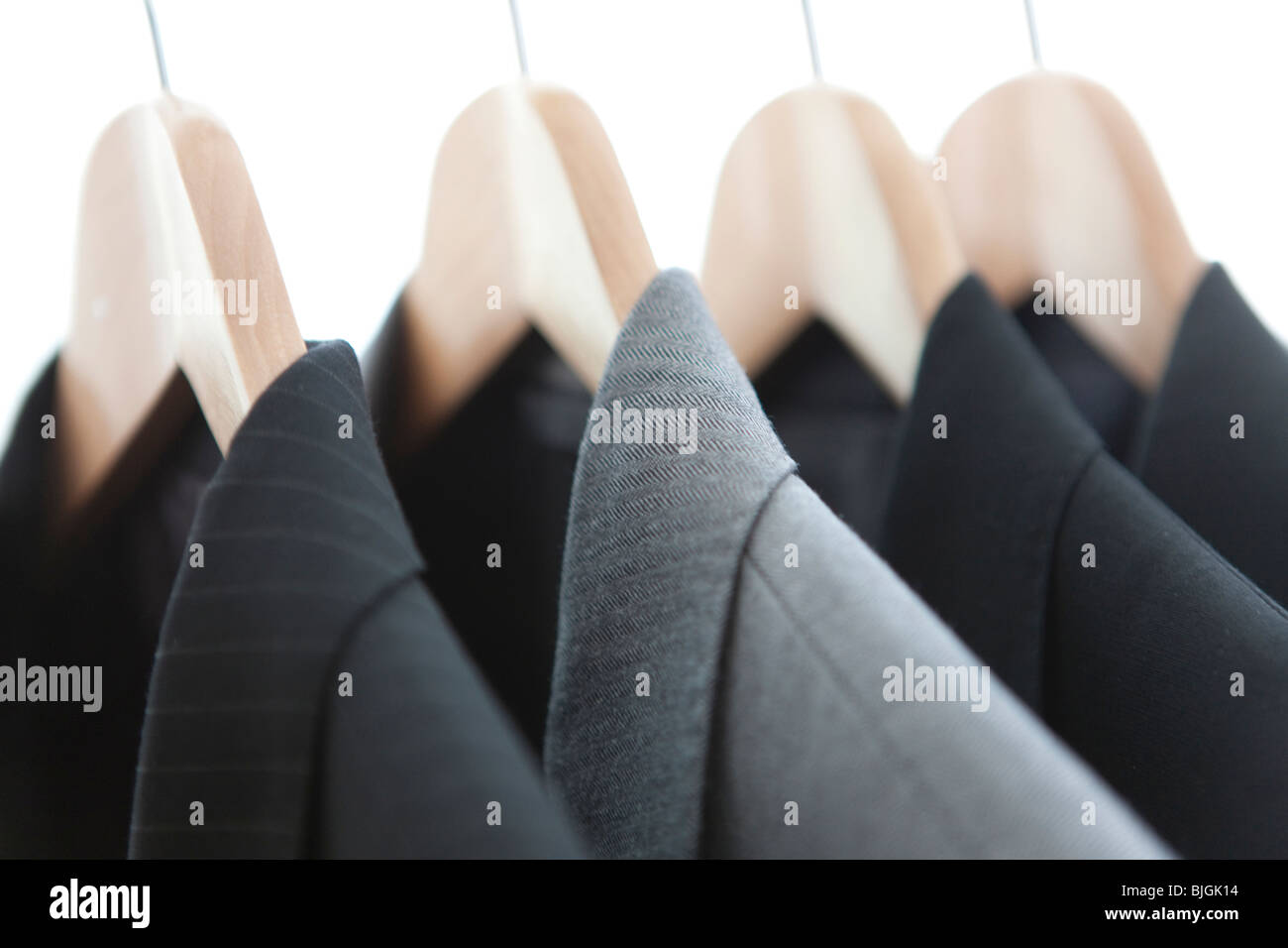 Suits on a clothes rack Stock Photo - Alamy