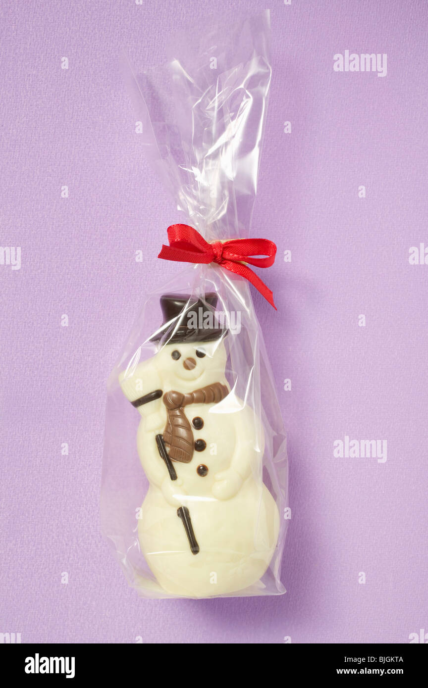 Chocolate snowman in cellophane bag - Stock Photo