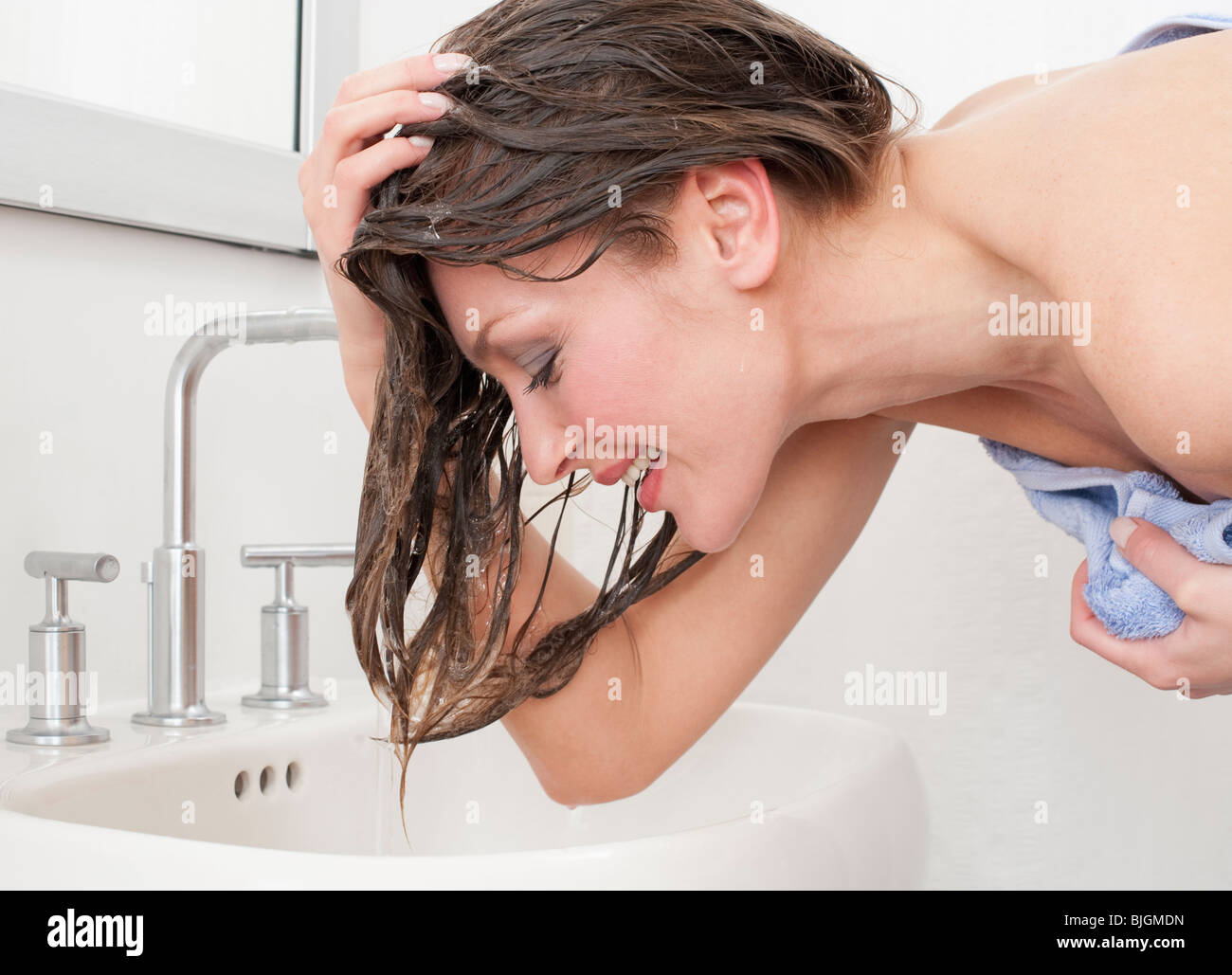 Woman washing hair Stock Photo