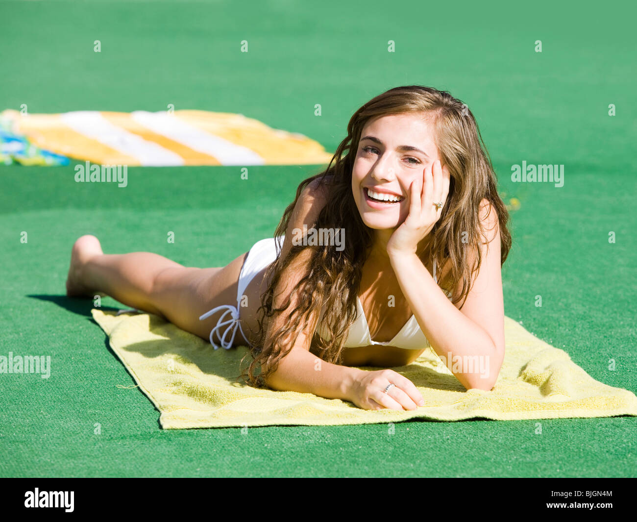 teenage girl in a white swimsuit Stock Photo