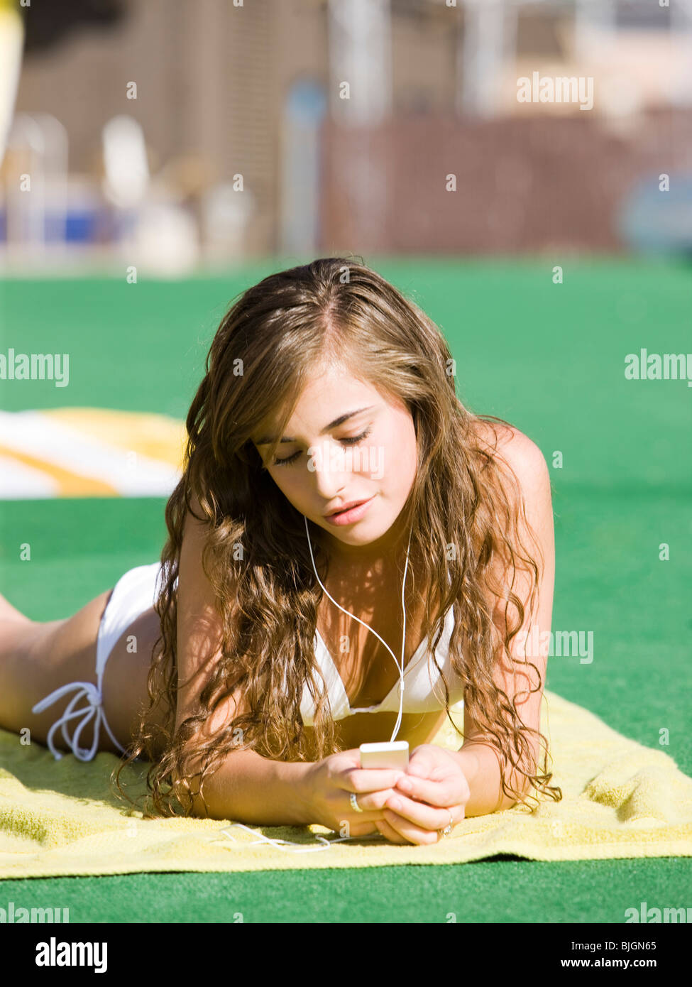 teenage girl in a white swimsuit Stock Photo