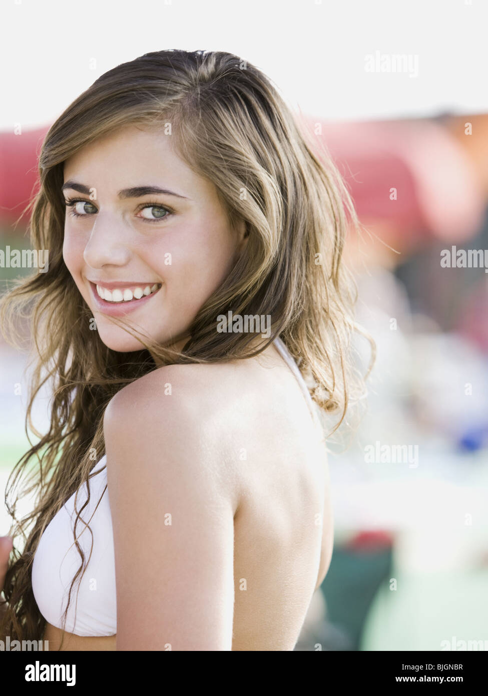 young woman in a white swimsuit Stock Photo