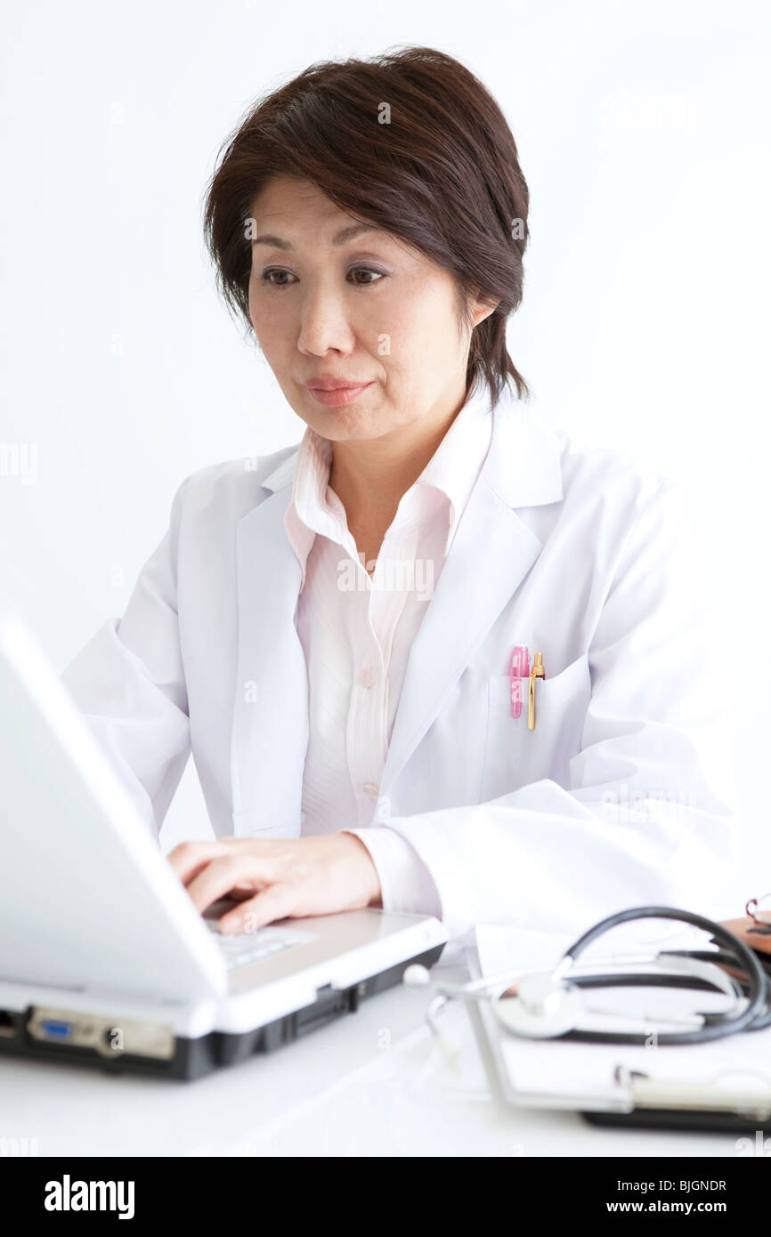 Doctor laptop woman typing hi-res stock photography and images - Alamy