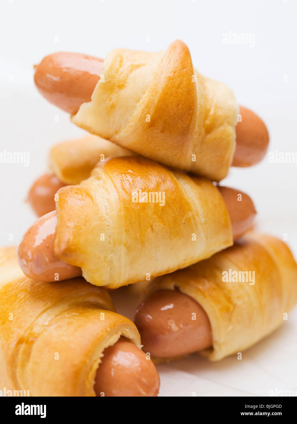 Sausage rolls (stacked) - Stock Photo