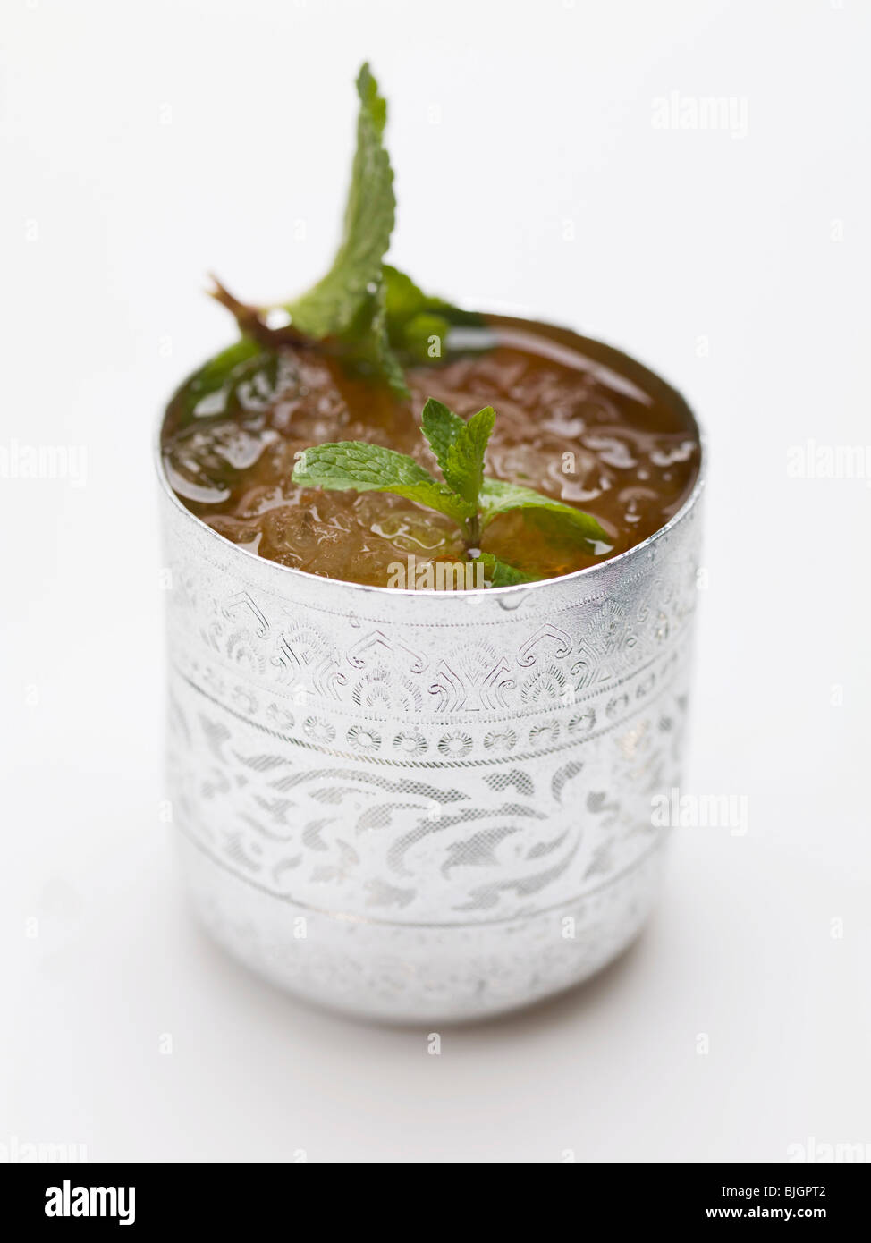 Cold peppermint tea in silver beaker - Stock Photo