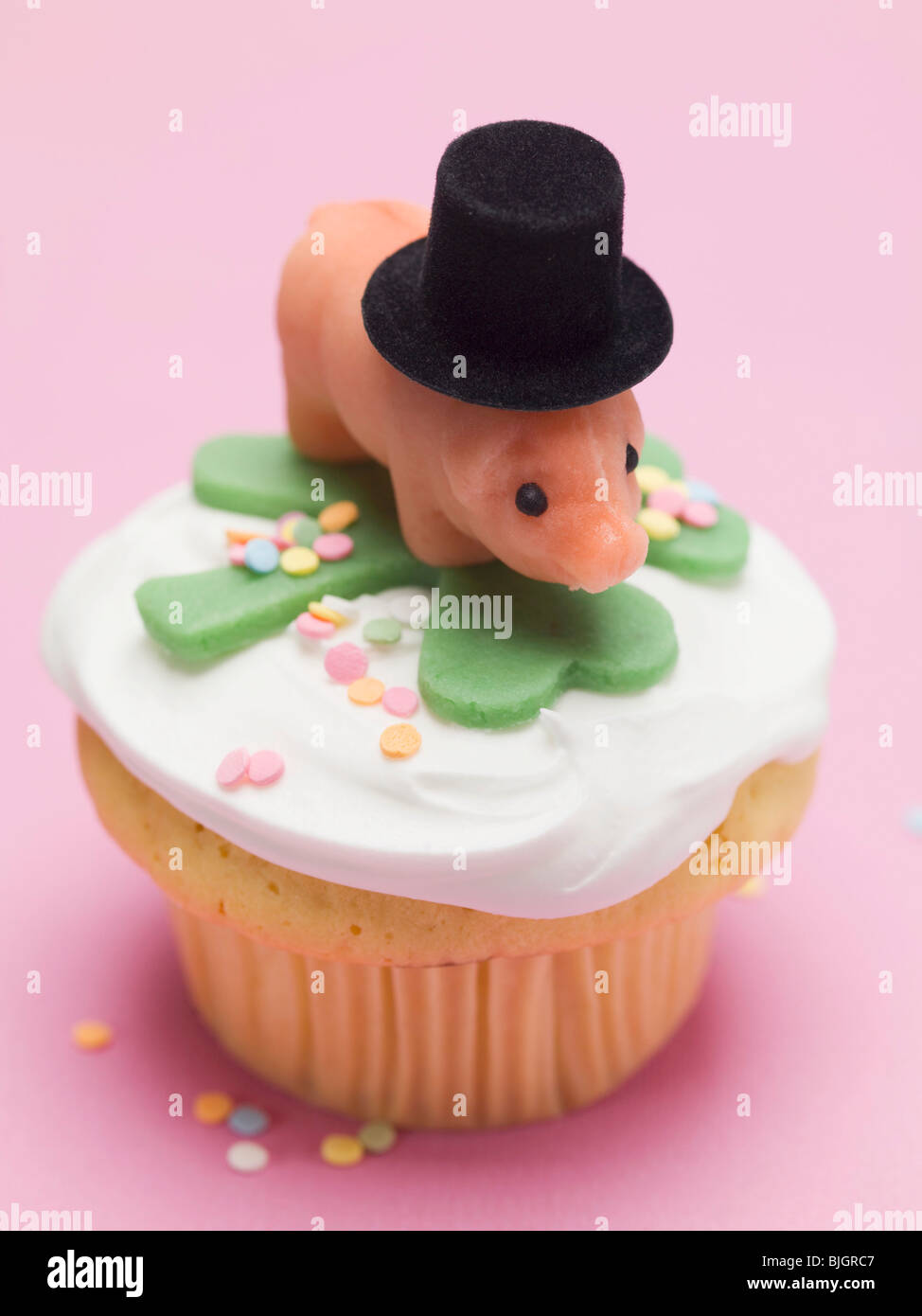 Cupcake with lucky charms for New Year's Eve - Stock Photo