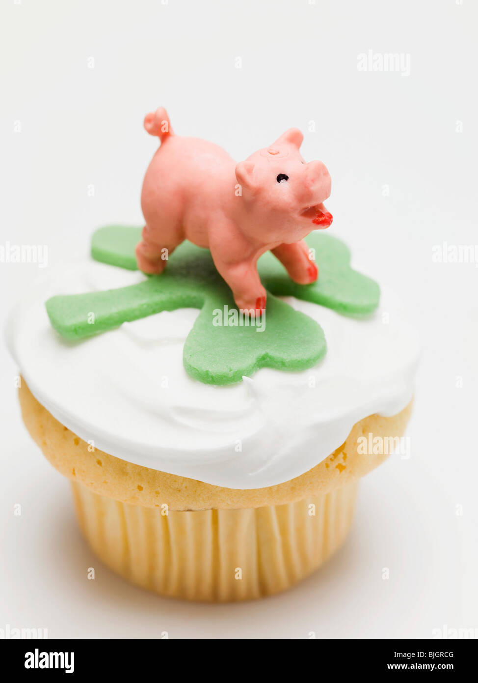 Cupcake decorated with lucky charms for New Year's Eve - Stock Photo