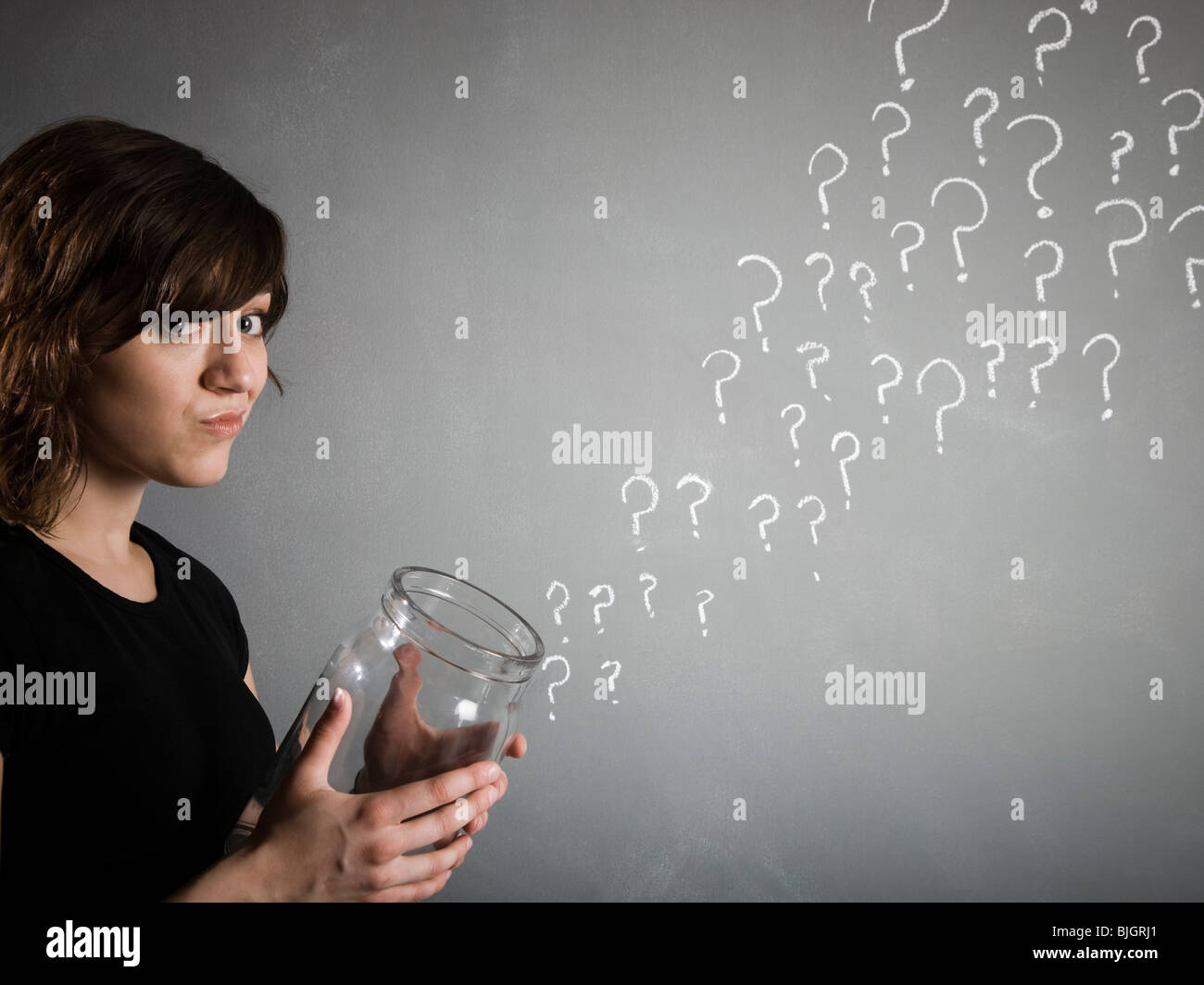 woman with a jar full of question marks Stock Photo Alamy