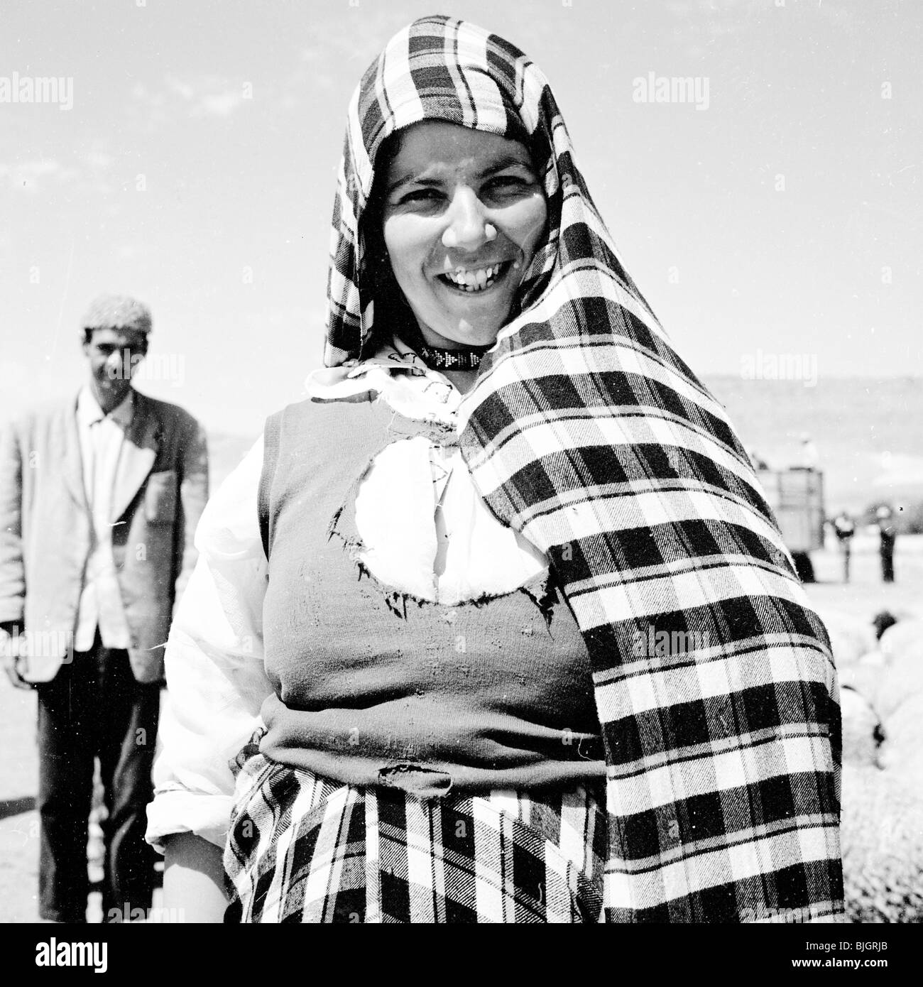 A portrait of local woman, a Maghrebi, wearing traditional headdress, Morocco, 1950s by J.Allan Cash. Stock Photo