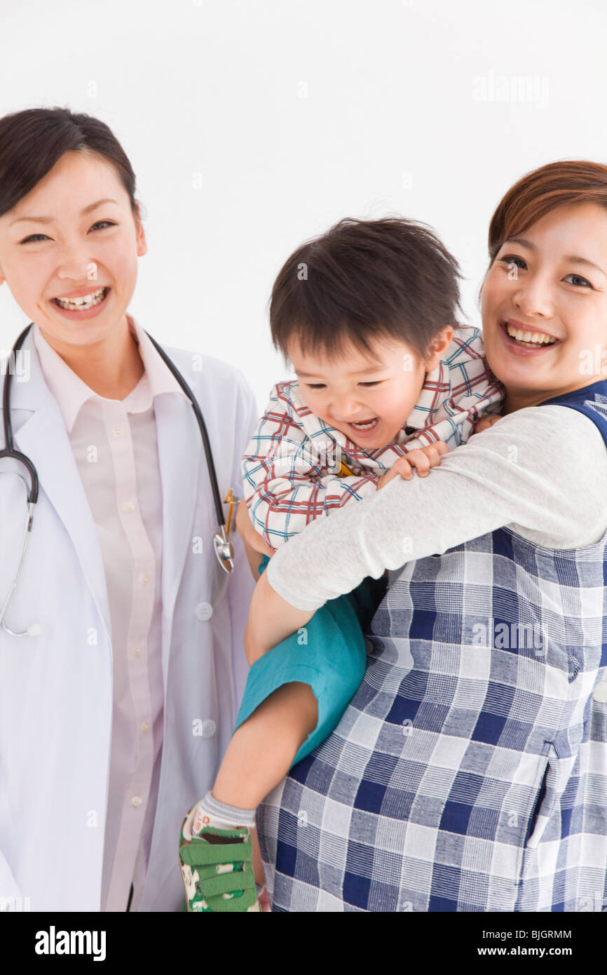 Pregnant mother and son with doctor Stock Photo - Alamy